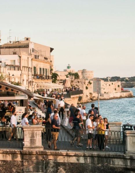 In Syracuse, taking a passeggiata, or evening walk, around the perimeter of Ortigia island, is a popular activity.CreditCreditSusan Wright for The New York Times