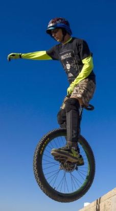 Mr. Peterson pulls a trick on his unicycle in Redondo Beach, Calif. PHOTO DAVID WALTER BANKS FOR THE WALL STREET JOURNAL