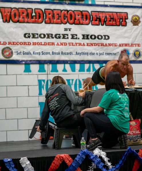 Mr. Hood, a former Marine and Drug Enforcement Administration agent, held a plank for eight hours, 15 minutes and 15 seconds.Credit...Josef Holic