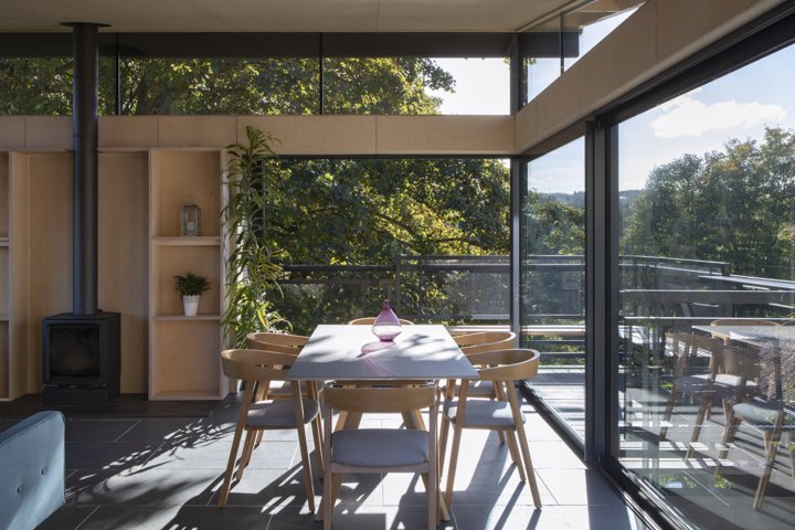 Garden room dining table with sliding doors to balcony